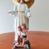 Guardian angel statue with kids